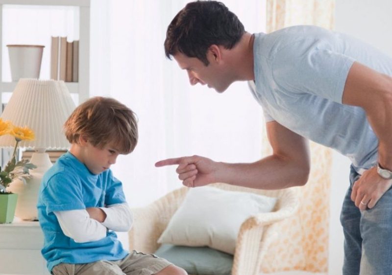 father scolding son