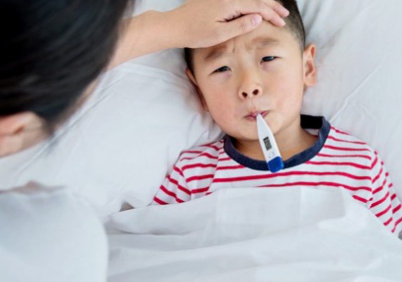 mother nursing sick child