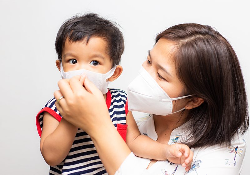 mother and child wearing masks