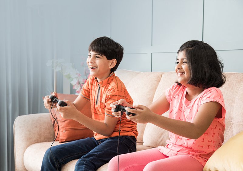 siblings playing video game