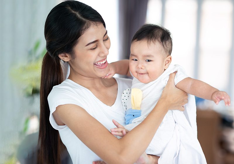 babysitter holding baby